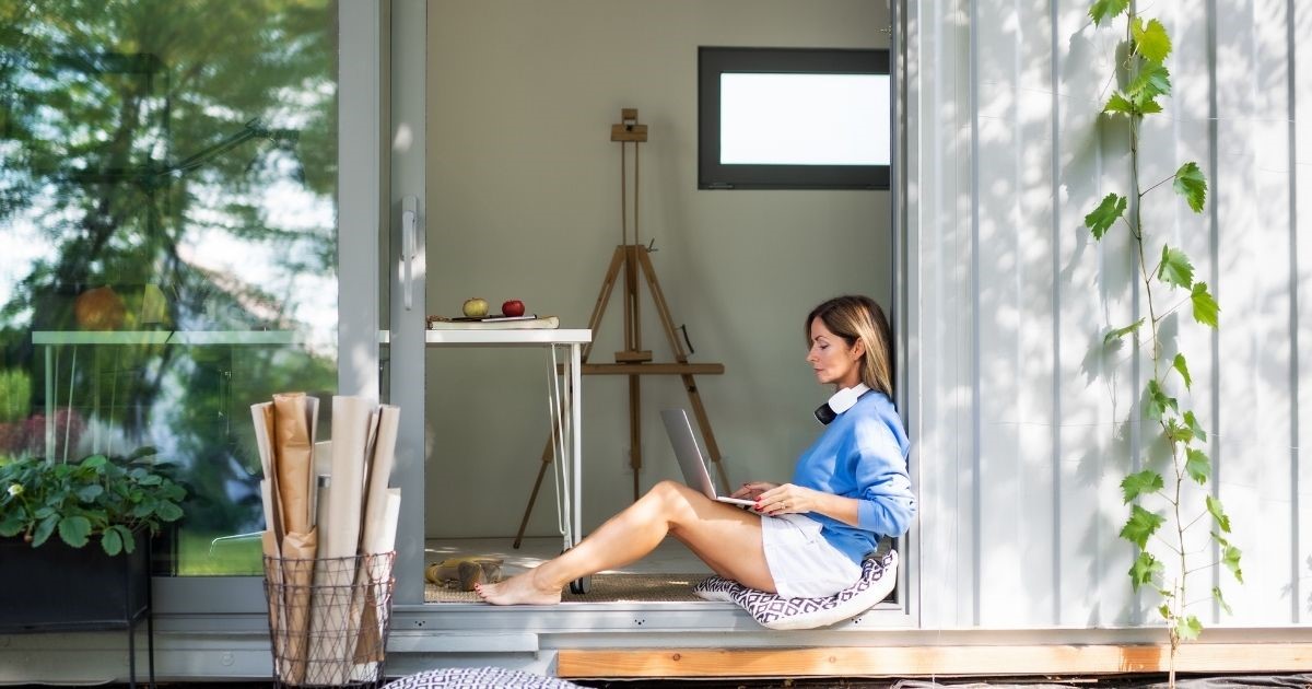 woman sitting inside container house
