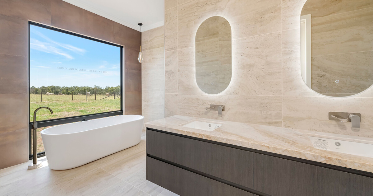 Luxurious ensuite with double mirrors and tub